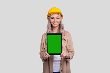 Girl Construction Worker Showing Tablet Green Screen Standing Isolated. Commecial, Shopping, Advertisment, Work, Construction Concept