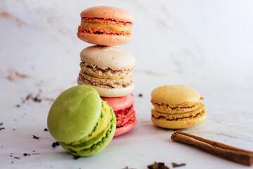 Delicious three multicolored macaroon on a white background