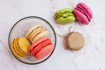 Delicious three multicolored macaroon on a white background