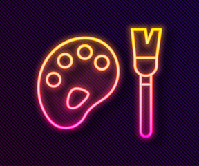 Glowing neon line Paint brush with palette icon isolated on black background. Vector.