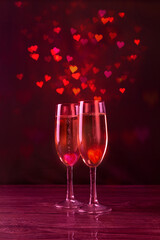 Two hearts, two glasses of champagne. many multi-colored hearts. Valentine's Day. beautiful card