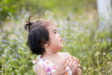 Cute girl smiling brightly in the setting sun