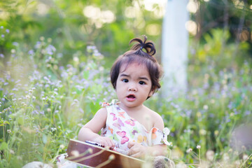 Cute girl smiling brightly in the setting sun