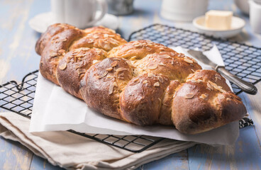 Tsoureki braid, greek easter sweet bread, on wood