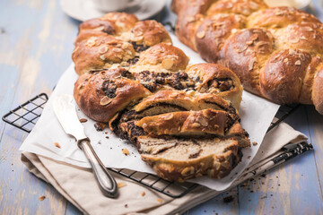 Tsoureki braid, greek easter sweet bread, on wood