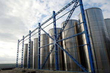 Winery. Stainless steel cylinders in a modern winery. day photo.