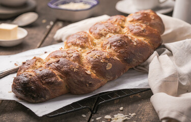 Tsoureki braid, greek easter sweet bread, on wood
