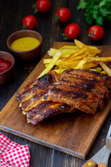 Barbecue ribs with French fries. American cuisine. Grill. Bbq.