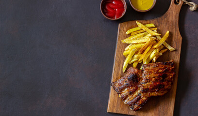 Barbecue ribs with French fries. American cuisine. Grill. Bbq.