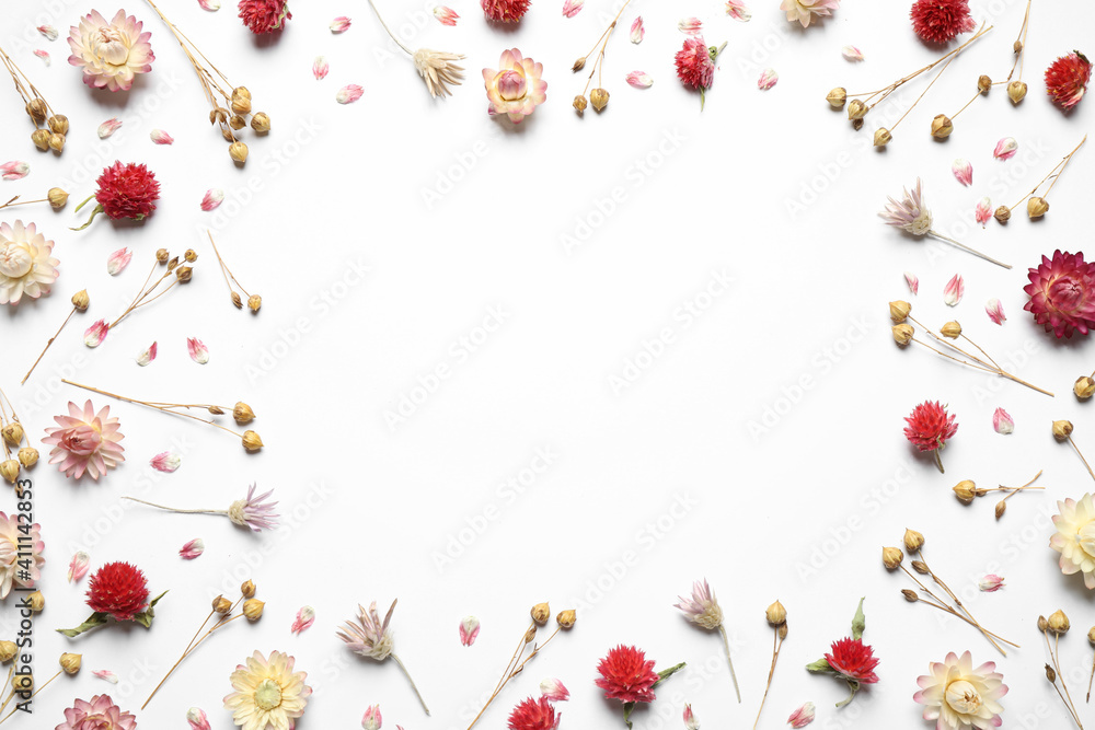 Wall mural frame of different dry flowers on white background, flat lay. space for text