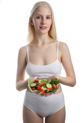 Smiling woman eating healthy salat