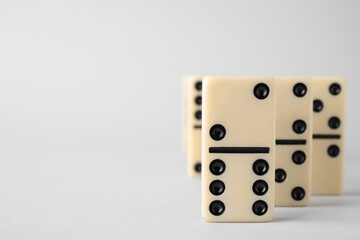 Domino tiles on white background. Space for text