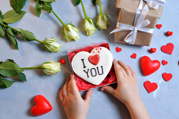 gingerbread in a box in the form of baked hearts for Valentine's day. Sweet sweets with love. Gift for Valentine's Day. Valentine day background