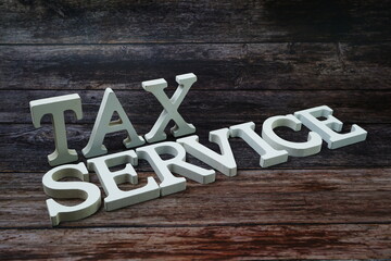 Tax Service Word alphabet letters on wooden background