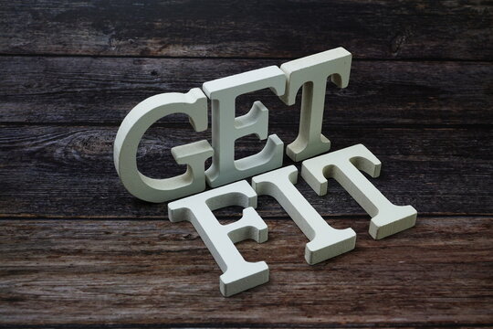 Get Fit Word alphabet letters on wooden background