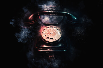 Vintage telephone on black background Concept of communication and technology