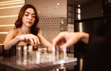 Concentrated beautiful girl playing chess on self isolation, selective focus.Woman and man competition in office, playing chess, strategy.