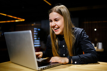 Normal working day of modern woman businessman. Beautiful young woman working at a laptop while...