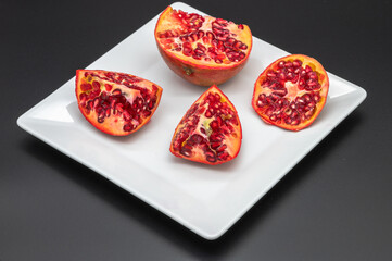 pomegranate fruit fresh on a dark background
