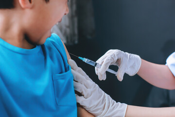 Close up of hands nurse are vaccinations to patients using the syringe. Doctor injecting patient...