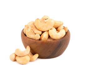 Cashew nuts in wooden bowl, isolated on white background. Roasted cashew nuts.