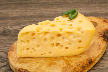 Maasdam cheese - yellow triangle with holes