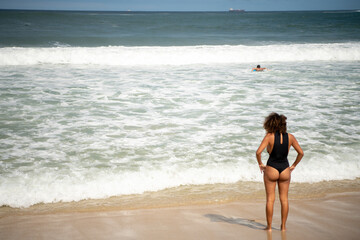   Citizens swim and sunbathe on the beach of Copacabana