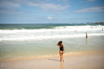  Citizens swim and sunbathe on the beach of Copacabana
