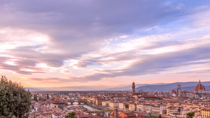 Fototapeta na wymiar Panoramic view of Florence skyline at Sunset with all famous landmarks. Palazzo Vecchio, Florence Cathedral, Ponte Vecchio. Tuscany, Italy