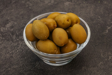 Green pickled olives in the bowl