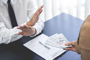 Businessman partner hand gesture rejecting refusing money, anticorruption concept.