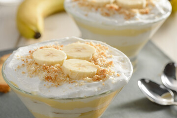 Banana slices and cookie crumbs on whipped cream mousse