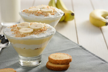 Banana cream pudding with crumbed cookie. Two portions of delicious dessert