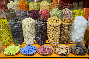 Sacks of dried spices, tea and incense at bazaar market in Dubai