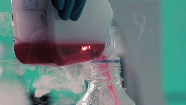 Chemical laboratory experiment with liquid. Smoke or steam in the laboratory