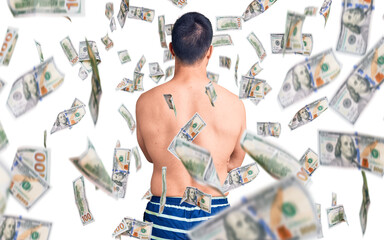Young handsome man wearing swimwear standing backwards looking away with crossed arms