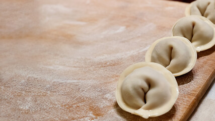 Home made dumplings on floured cutting board