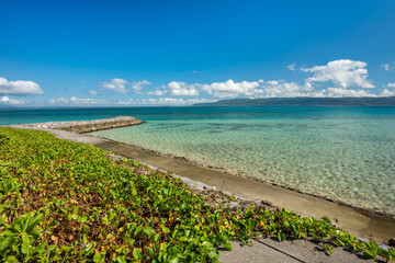 Beautiful view of the turquoise sea between Hatoma and Iriomote island in the background, Japan.