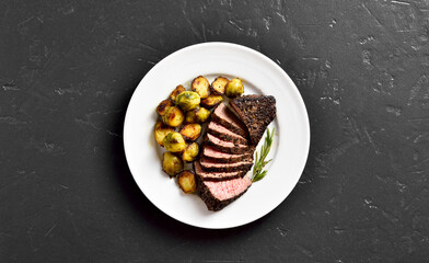 Grilled beef steak with brussels sprouts