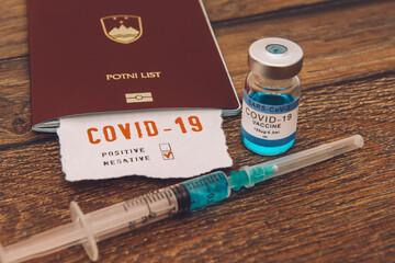Coronavirus and travel concept, a note COVID-19 in tourist passport. Medical test at border control...