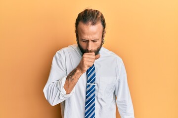 Handsome man with beard and long hair wearing business clothes feeling unwell and coughing as symptom for cold or bronchitis. health care concept.