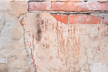 old brick wall. cracked concrete. pink, brown texture. vintage background