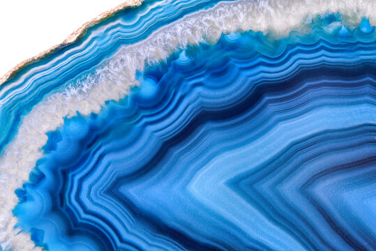 Amazing Blue Agate Crystal cross section isolated on white background. Natural translucent agate crystal surface, Blue abstract structure slice mineral stone macro closeup