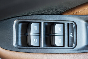 buttons controlling the windows inside a car, control and electric mirror adjustment