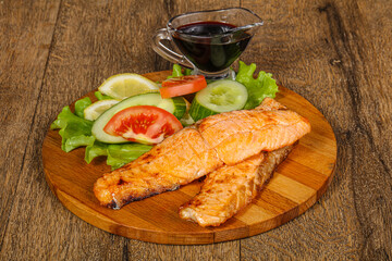 Grilled salmon served vegetables and lemon