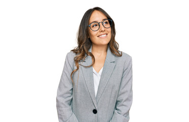Young brunette woman wearing business clothes looking away to side with smile on face, natural...