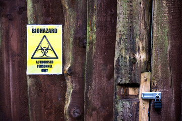 Chemical factory biohazard sign danger warning at entrance gate