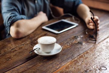Fototapeta na wymiar Coffee break with tablet