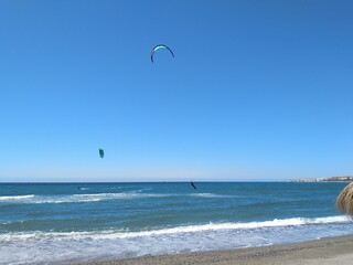 Fototapeta na wymiar kite surfing on the beach