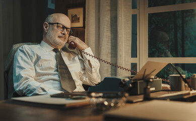 Vintage style journalist having a phone call